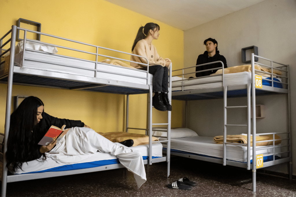 Group of travelers in a shared room at Onefam Les Corts Hostel in Barcelona