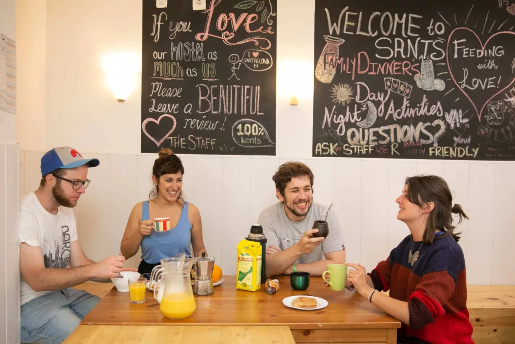 Group of travelers at common area of Onefam Sants Hostel in Barcelona